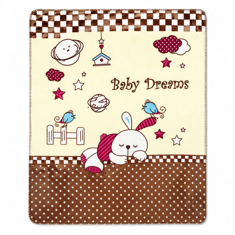A baby blanket featuring a cute cartoon design with the text 'Baby Dreams'. The blanket has a cream center with illustrations of a sleeping bunny, stars, planets, birds, and clouds, bordered by brown and white checkered stripes at the top and a brown polka-dot section at the bottom.
