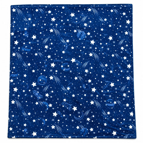 A square blanket featuring a space-themed print with white stars, shooting stars, and blue planets on a dark navy blue background.
