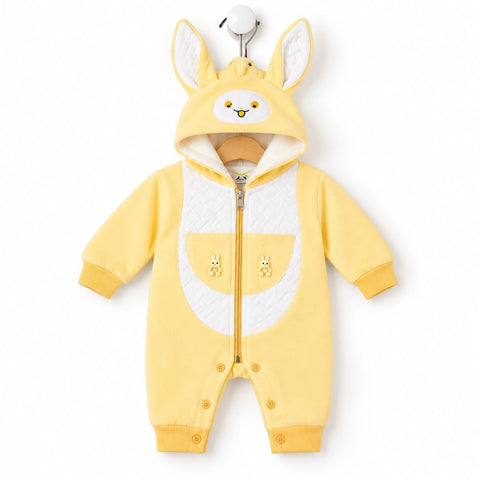 A baby's yellow hooded romper with long sleeves and legs, featuring a white belly panel, embroidered bunny details on the chest, and a hood with bunny ears and a bunny face.