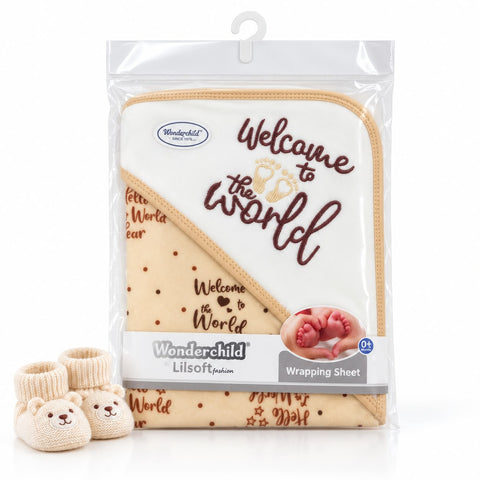 Wonderchild Lil' Soft Gauze Welcome to the World baby wrapping sheet in its clear plastic packaging, shown with two matching cream teddy bear booties on a white background.