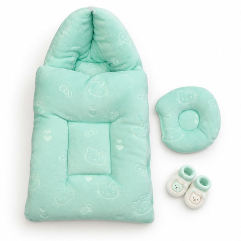 A mint green baby sleep bag set with a matching head cushion and small booties, featuring a white Hello Kitty face pattern, displayed on a clean white background.