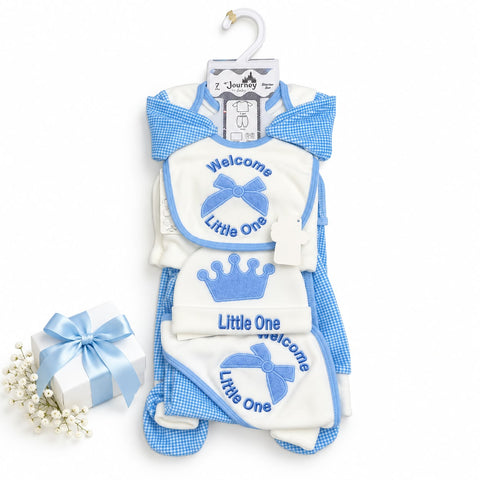 A baby clothing set from Z Joyful on a white hanger, featuring a blue and white gingham romper, matching bib, and hat with embroidered details, displayed next to a small gift box with a blue ribbon.