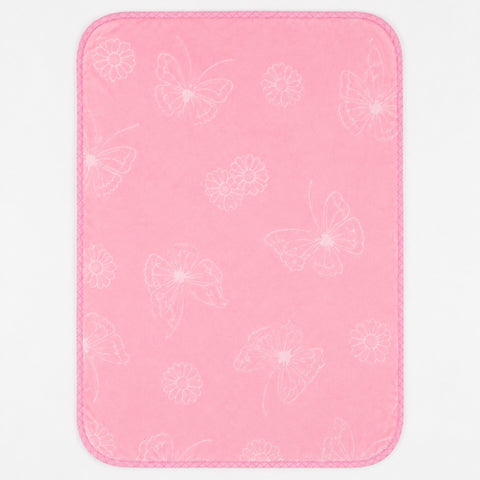 A pink rectangular mat with rounded corners, featuring a subtle white outline pattern of butterflies and flowers, shown against a plain white background.