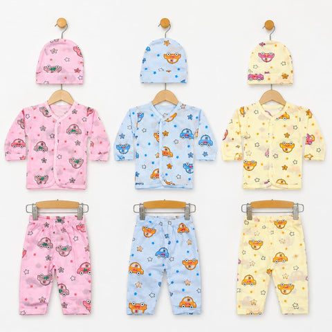 Six baby clothing sets displayed on wooden hangers against a white background, each set including a hat and matching outfit in pink, light blue, or pale yellow. The garments feature playful cartoon patterns of cars, stars, and mushrooms.