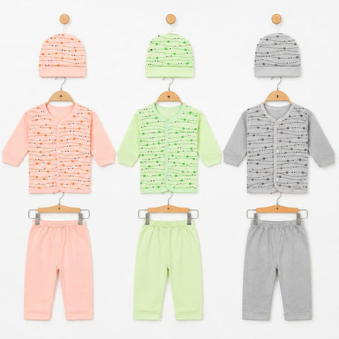 Three baby clothing sets displayed on wooden hangers against a white background, each set including a knit beanie, a patterned vest, and matching pants. The sets are in pastel peach, mint green, and light gray with black dash-like line patterns.