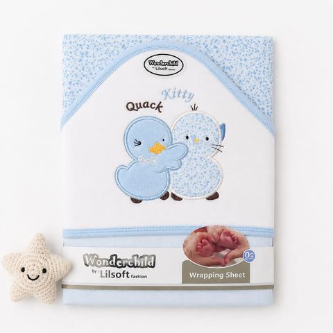 A baby wrapping sheet by Wonderchild by Lilsoft, featuring a light blue and white patterned design with embroidered cartoon chicks. A small cream-colored crochet star toy is placed to the left of the sheet on a clean white background.