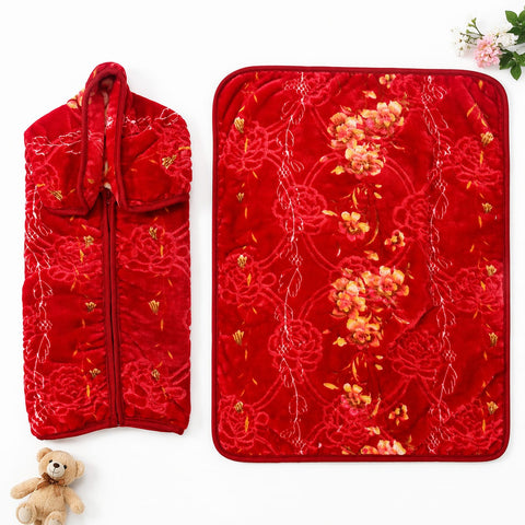 A red quilted embroidered garment bag and matching rectangular cover, both decorated with floral and knot-like embroidery, shown on a white background with a small teddy bear and flowers as props.