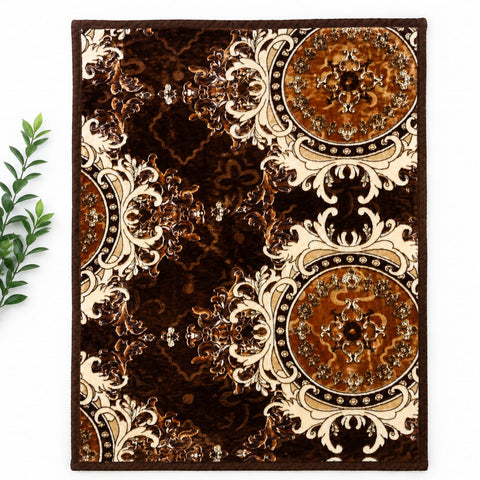 A rectangular area rug with an ornate damask pattern in dark brown, bronze, and cream, shown flat on a white background with a small green plant branch on the left.