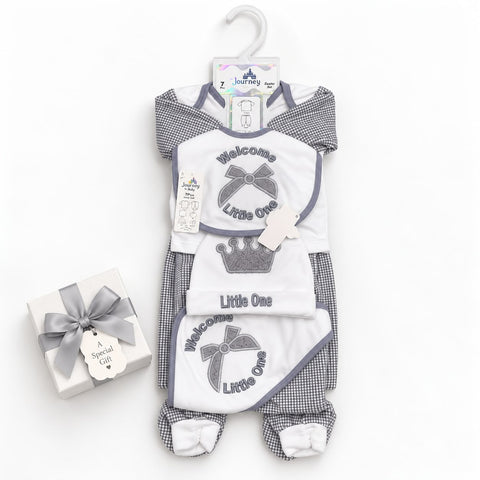A baby footed one-piece romper set in white and gray gingham, featuring a 'Welcome Little One' bib design with a crown graphic. The set includes a matching footed sleeper and a small gift box with a ribbon, displayed on a white background.