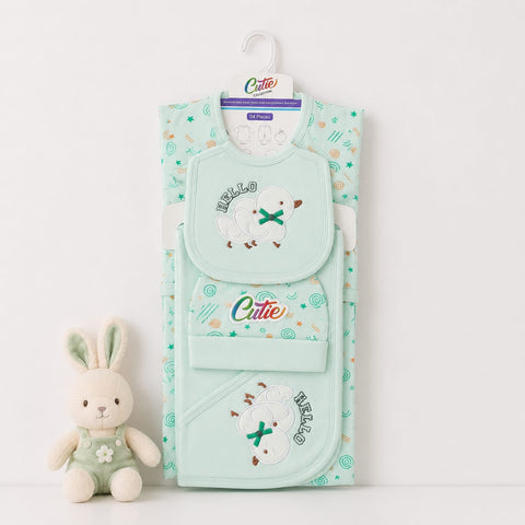 A mint green baby bib set by Cutie, featuring a main bib with a sheep applique and a matching pocket organizer, displayed next to a small plush bunny on a white background.