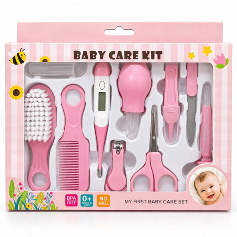 Baby care kit in pink packaging, containing a pink baby brush, comb, thermometer, nasal aspirator, nail clipper, scissors, and tweezers, with a baby photo printed on the box.