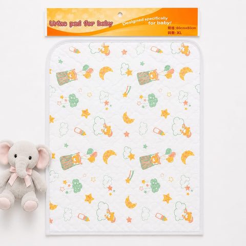 A baby sleep pad with a white quilted background and a colorful pattern of sleeping bunnies, crescent moons, stars, and clouds, shown with its orange header card and a small plush elephant toy on a white background.