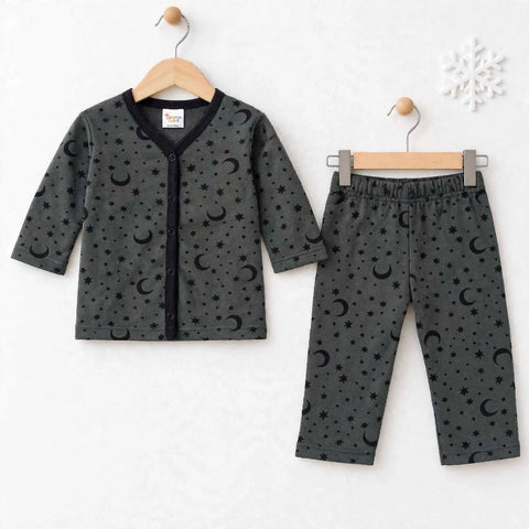A two-piece baby pajama set consisting of a long-sleeve cardigan top and matching pants, both in dark gray with a black crescent moon and star pattern, hanging on wooden hangers against a white textured background.