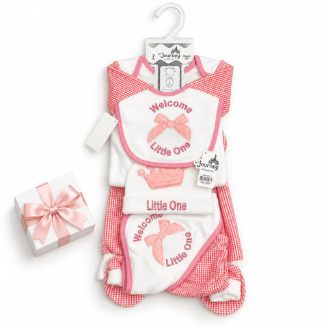 Baby gift set featuring a pink and red gingham romper, a white bib with pink trim and 'Welcome Little One' text, and a small wrapped gift box on a white background.