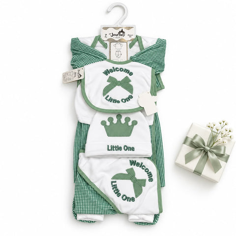 A baby gift set featuring a green and white gingham romper, a matching bib, and a footed bootie, all printed with 'Welcome Little One' and a crown or bow graphic. The set is displayed on a white background next to a small gift box with a green ribbon.
