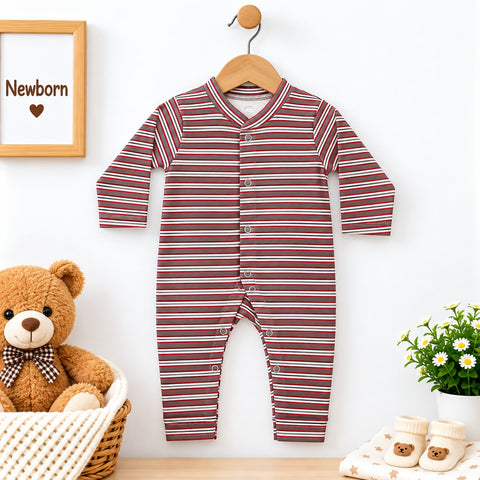 A baby long-sleeve striped footless romper hanging on a wooden hanger against a white wall. The romper has thin horizontal stripes in red, brown, and white, with snap buttons down the front.