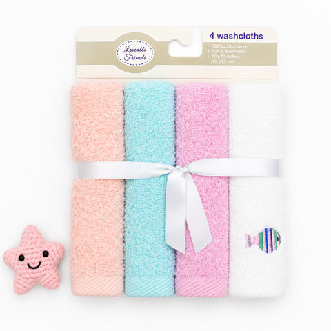 A package of four baby washcloths in pastel peach, light blue, pink, and white, tied with a white ribbon. A small pink crocheted starfish toy is placed to the left of the package on a clean white background.