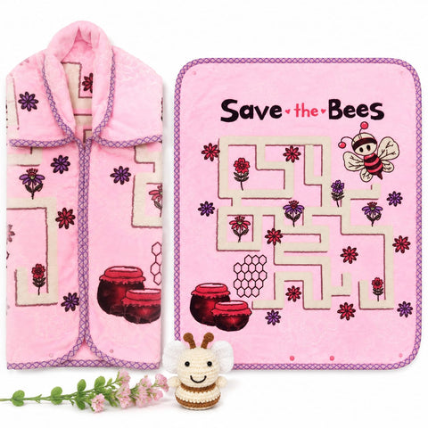 A pink baby blanket and matching pink swaddle blanket set with a 'Save the Bees' honeycomb maze design, shown on a white background with a small plush bee toy and flowers.