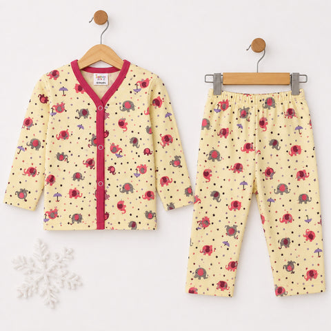 A baby two-piece pajama set hanging on wooden hangers against a white background. The set includes a long-sleeve cardigan with a red V-neck trim and button front, and matching pants.