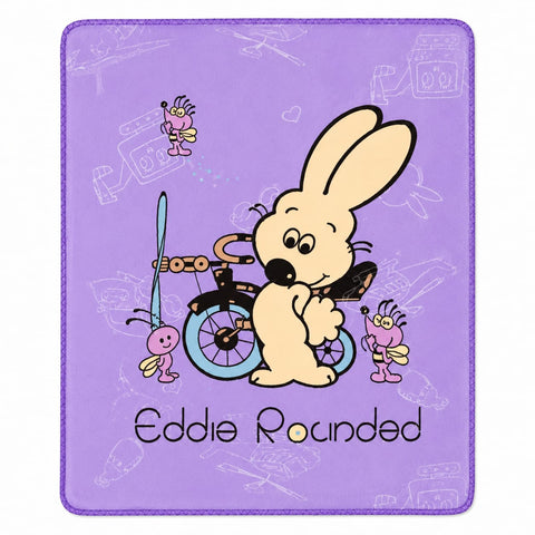 A square purple mousepad featuring a cartoon illustration of a beige rabbit riding a bicycle with pink and yellow insects, and the text 'Eddie Rounded' at the bottom.