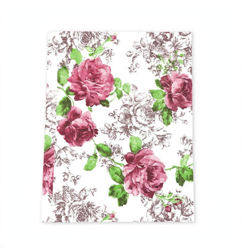 A rectangular notebook or journal with a white cover featuring a vintage floral pattern of pink roses and green leaves over a delicate gray toile-style background.