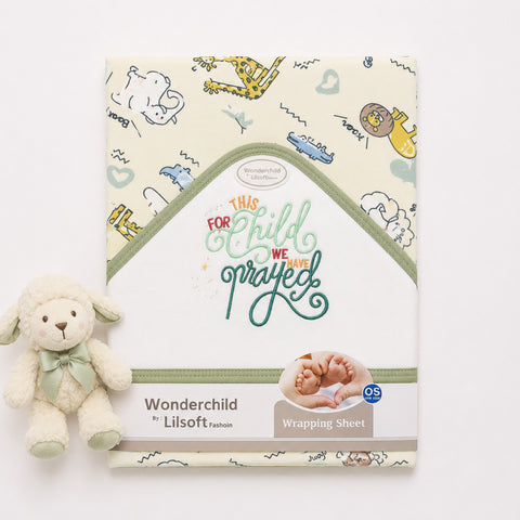 Wonderchild by Lilsoft Fashion baby wrapping sheet with a cream background and multicolor cartoon animal illustrations, shown folded with a small plush sheep toy beside it on a white background.