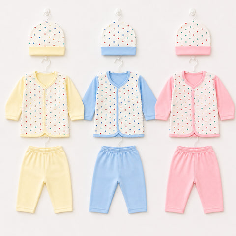 Three baby clothing sets displayed on hangers against a light background. Each set includes a matching hat, long-sleeve top, vest, and pants in soft pastel colors: yellow, light blue, and pink.